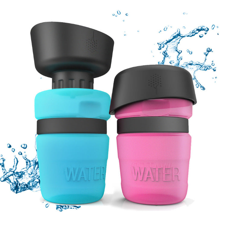 Dog Travel Portable Water Bottle in blue and pink with splashes of water.